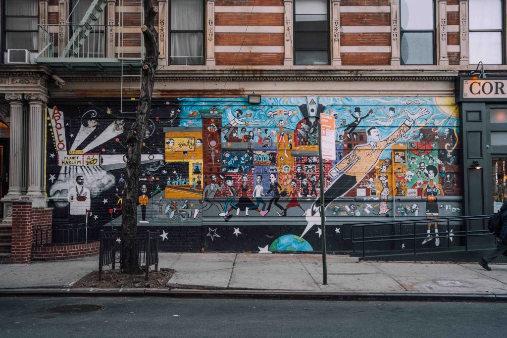 View of mural on the history of Harlem and the Apollo Theater. Click on the photo for a link to our Offbeat New York tour of Harlem and Columbia University.