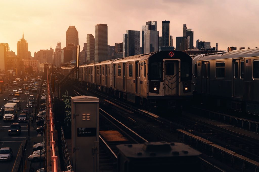Line 7 train leaving a station in Queens and going towards the sunset. 
